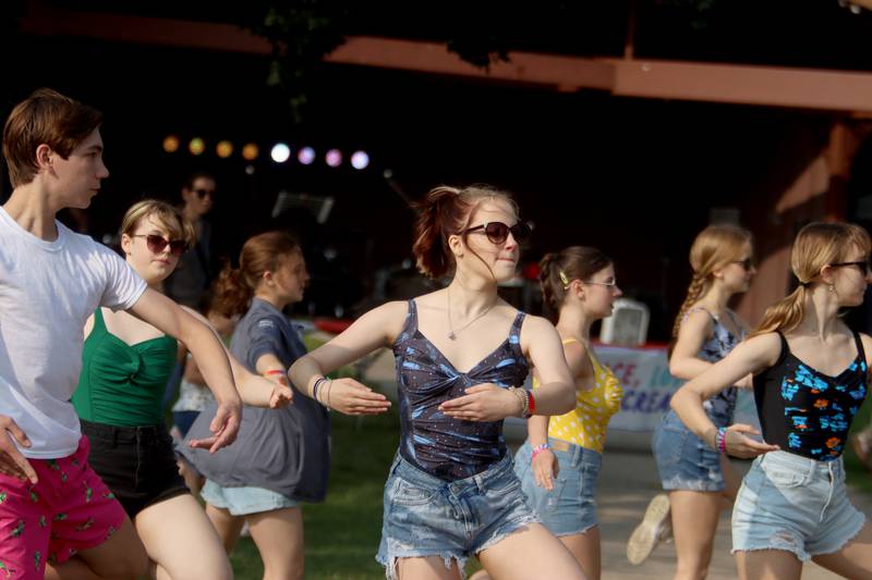 Performers from the Engage Dance Academy groove during a pop-up contemporary jazz number Friday, Aug. 18, 2023, at Julie Ann’s first-ever Ice Cream Fest at Crystal Lake’s Main Beacj.