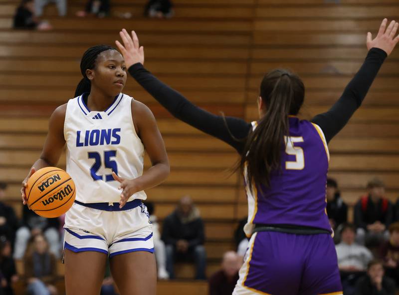 Lyons' Nora Ezike (25) handles the ball during the girls varsity basketball game between Downers Grove North and Lyons Township on Saturday, Jan. 11, 2025 in La Grange.