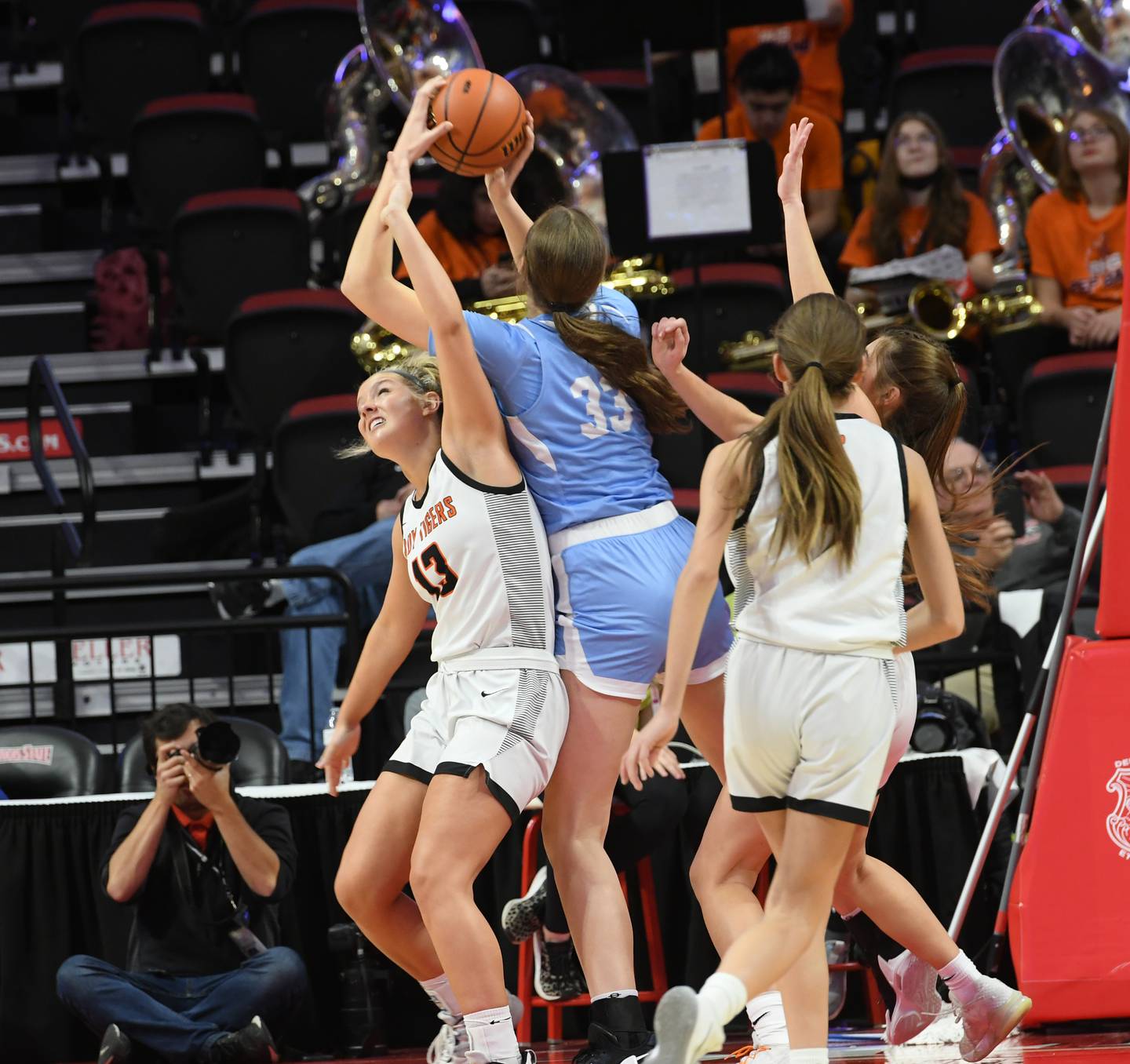 Breese Mater Dei's Alyssa Koerkenmeier (33) jumps over Byron's Ella Grundstrom for a rebound during the 2A championship at Redbird Arena in Normal on Saturday, March 4.