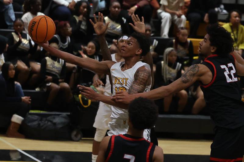 Joliet West’s Zion Gross lays in a shot against Bolingbrook on Friday, Jan 24, 2025 in Joliet.