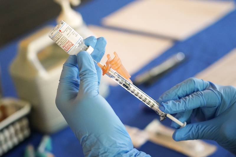 FILE - A nurse prepares a syringe of a COVID-19 vaccine at an inoculation station in Jackson, Miss., July 19, 2022. U.S. health officials are proposing a simplified approach to COVID-19 vaccinations, which would allow most adults and children to get a once-a-year shot to protect against the mutating virus. The new system unveiled Monday, Jan. 23, 2023 would make COVID-19 inoculations more like the annual flu shot. Americans would no longer have to keep track of how many shots they’ve received or how many months it’s been since their last booster. (AP Photo/Rogelio V. Solis, File)