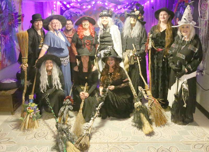 The Village Witches (from left) Jeanie Lutz, Becca Nerad, Zane Billings (sound) Kathy Pufahl, Mary Glenn, Teresa Verduzco, Jaime Thompson, Sue Harden. (Front from left) Jeri Etscheid, Ashley Hensley and Dora Brooks pose for a photo on Wednesday, April 30. 2025 at Crafty Eclectic in La Salle. The witches performed five dances as a part of a world wide witches dance to honor the original Wolfshager Hexenbrut, a meaning "The Wolf Hunter's Coven," a group of women from Germany known for the choreographed with dance. The witches also dedicated their performance to their friend RJ who passed away recently.