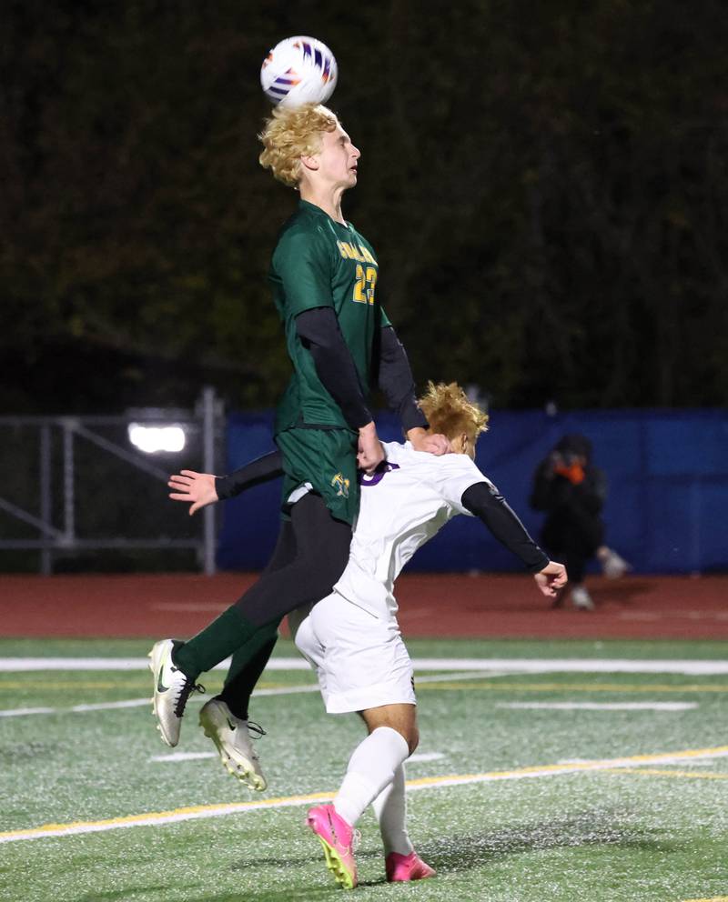 Coal City's AJ Kenney gets up over Mendota's Hugo Falcon to head the ball Thursday, Nov. 6, 2025, during their Class 1A state semifinal game at Hoffman Estates High School.