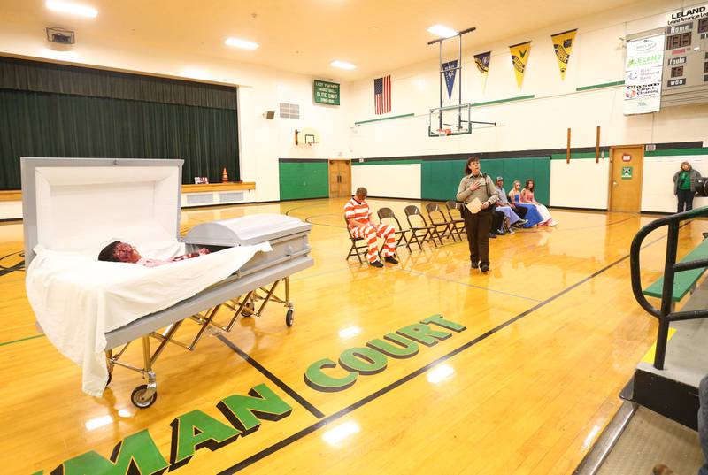 Felecia Rasmussen, La Salle County Deputy Sheriff speaks to Leland High School students during a Mock Prom drill at Leland High School on Friday, May 6, 2022 in Leland. A casket was placed into the gymnasium after student Alex Todd died in a fake accident.