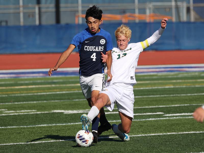 Coal City's Dane Noffsinger tries to kick the ball away from Chicago Academy's Daniel Delgado-Perez Friday, Nov. 7, 2025, during their Class 1A state third place game at Hoffman Estates High School.