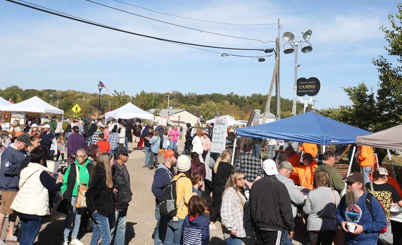 People wait in line for a bowl of Burgoo during the 54th annual Burgoo on Sunday, Oct. 13, 2024 downtown Utica.