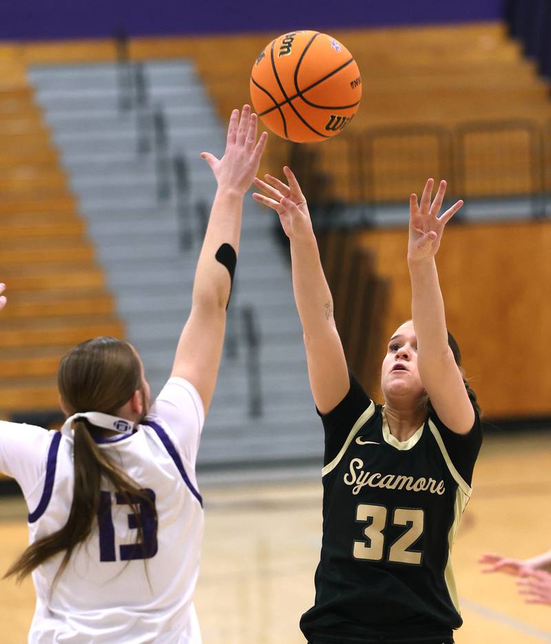 Sycamore's Quinn  Carrier shoots over Rochelle's Reese Kissack Friday, Dec. 5, 2025, during their game at Rochelle High School.