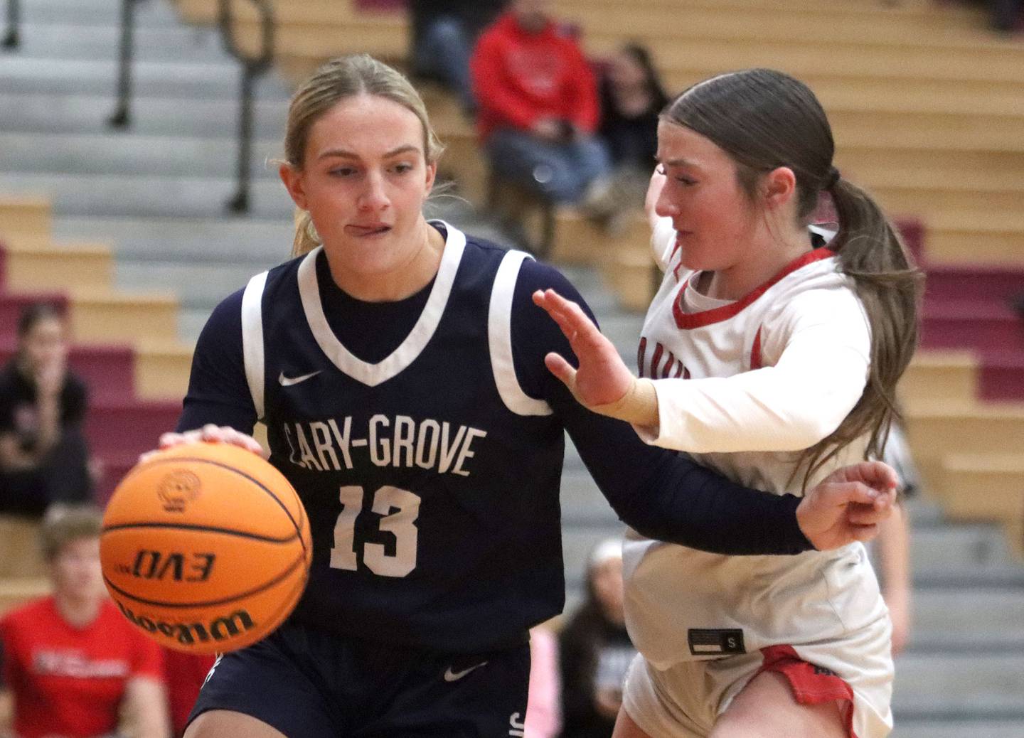 Huntley’s Lana Hobday, right, keeps pace with Cary-Grove’s Malaina Kurth in varsity girls basketball on Monday, Feb. 2, 2026, at Huntley High School in Huntley.