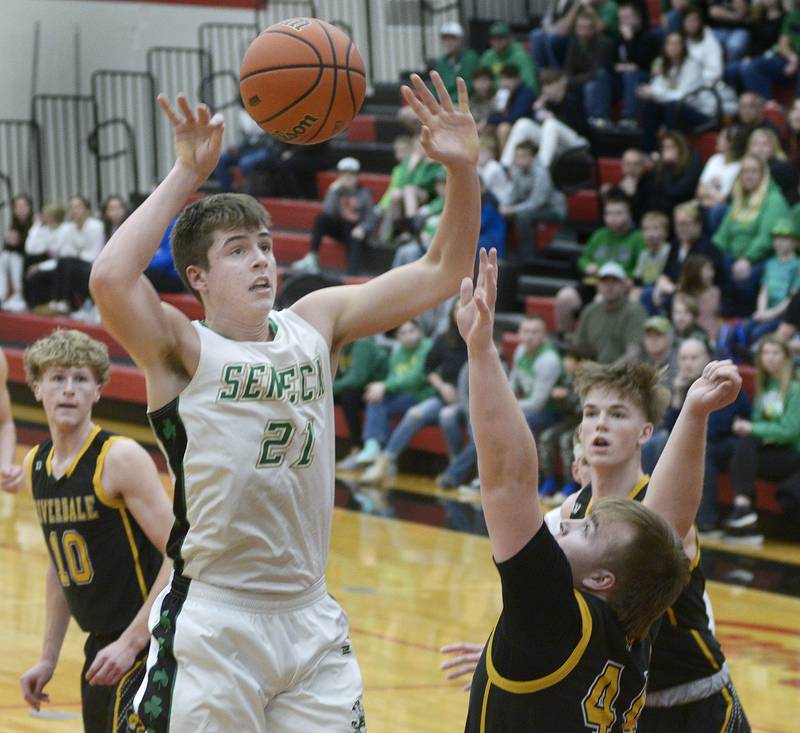 Seneca’s Lane Provance lets go with a shot above the block of Riverdale’s Dawson Peterson during the 1st period Friday at Regional Championship at Hall.