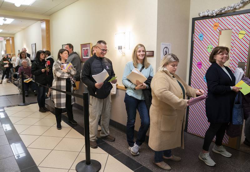 School board candidates line the hallway during the first day area school board candidates could file for the April election on Monday, Dec. 12, 2022, at the McHenry County Administration Building in Woodstock.
