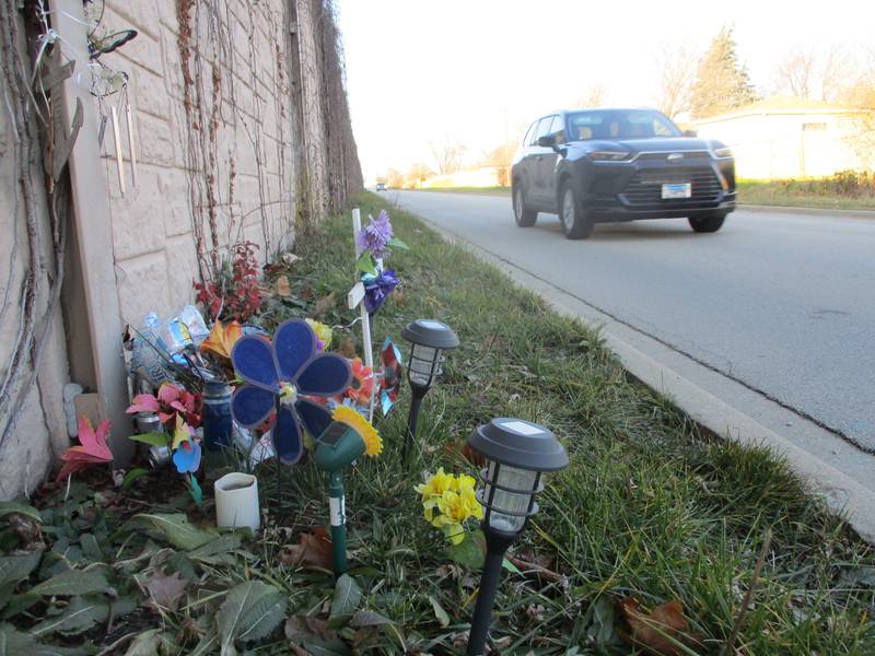 A memorial is set up along the Interstate 55 Frontage Road at Pandola Avenue, a Joliet intersection where an April collision ended led to the deaths of two people. Dec. 11, 2023.