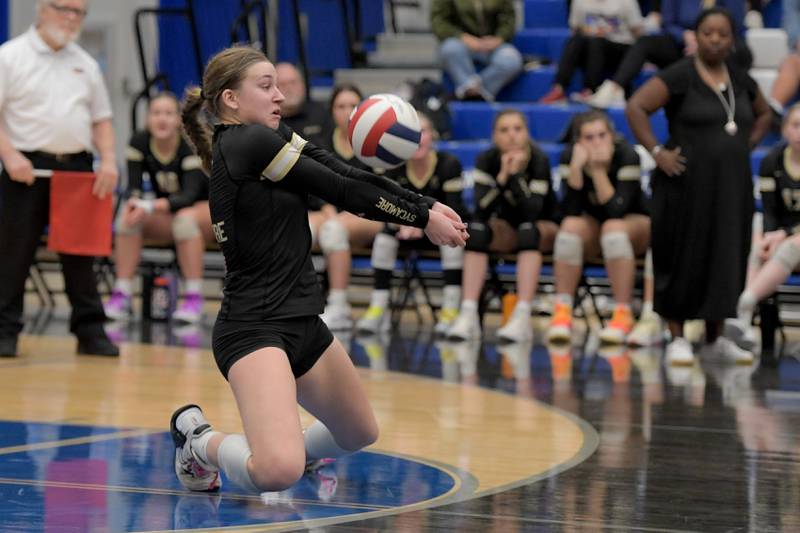Sycamore's Laci Neece (7) returns the ball against Central during the Class 3A Burlington Central Girls Volleyball Regional on Thursday, Oct. 26, 2023.
