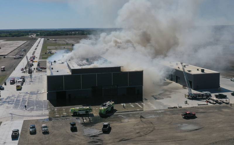 Smoke billows from Marquis Energy as firefighters work to control a structure fire on Wednesday, Oct. 8, 2025 in Hennepin. The fire was upgraded to a 5th alarm dispatching the (MABAS) Mutual Aid Box Alarm System. The fire broke out around 11a.m.