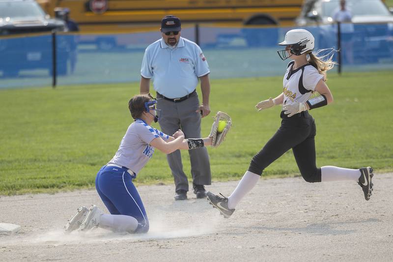 Newman’s Lucy Oetting waits to tag out Putnam County’s Salina Breckenridge looking to steal second Thursday, May 18, 2023.