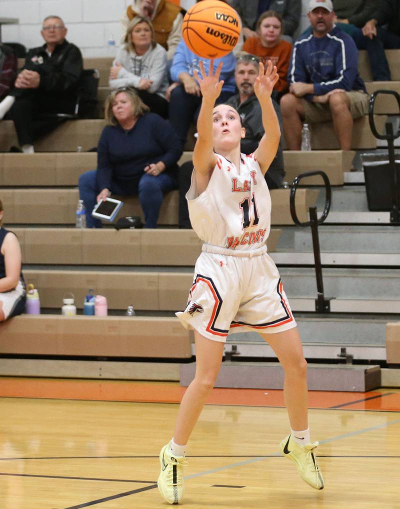 Flanagan-Cornell/Woodland's Ava Price shoots a wide-open jump shot against Fieldcrest during the Falcon-Irish Thanksgiving Tournament on Monday, Nov. 18, 2024 at Flanagan High School.
