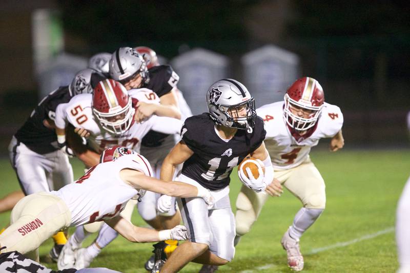Kaneland's Dominic DeBlasio looks for a gain against Morris on Friday, Sept. 8, 2023 in Maple Park.