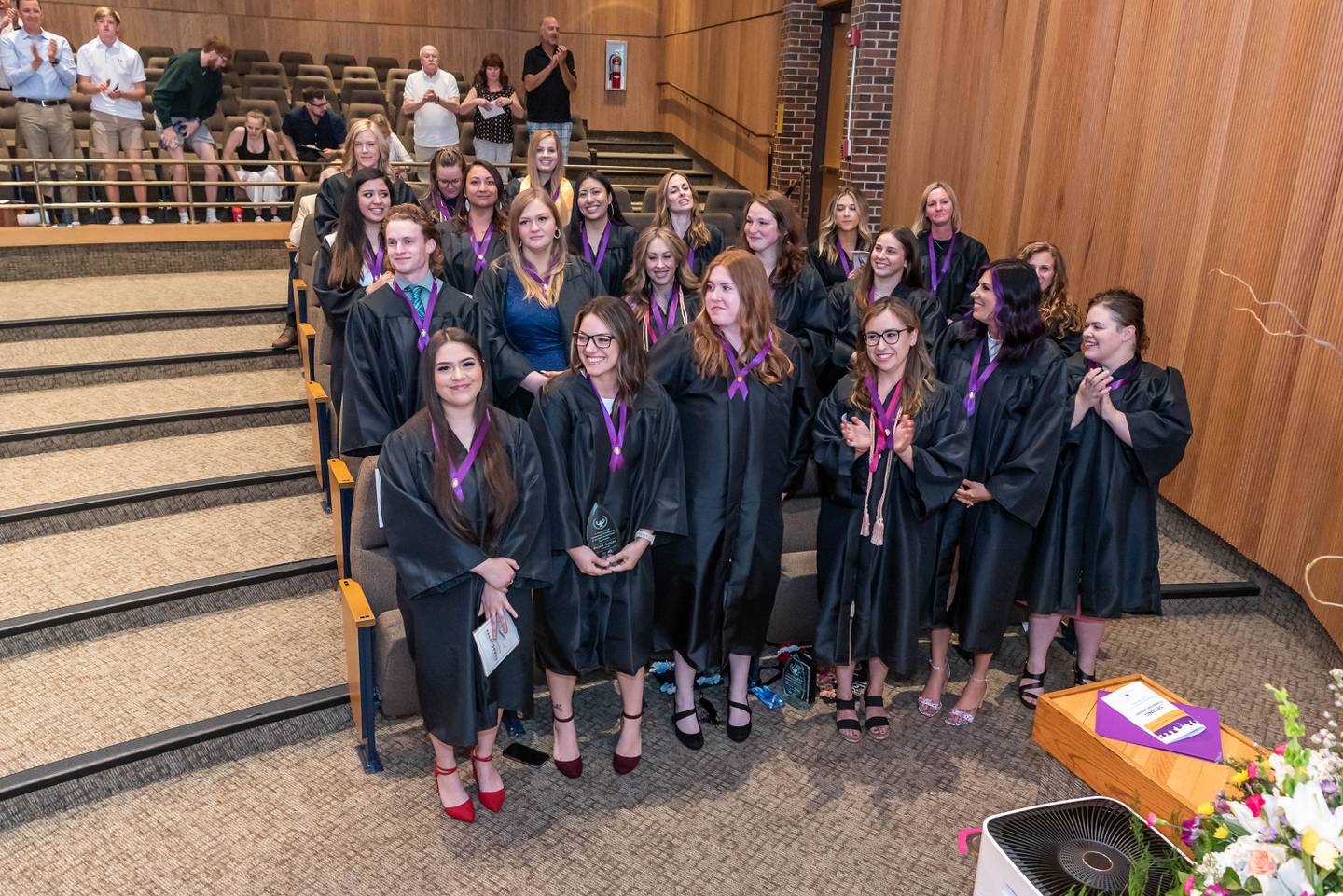 A new nursing graduate is recognized as part of the nursing pinning ceremony, held prior to the college's commencement ceremony, on Saturday, May 14, 2022, at McHenry County College.