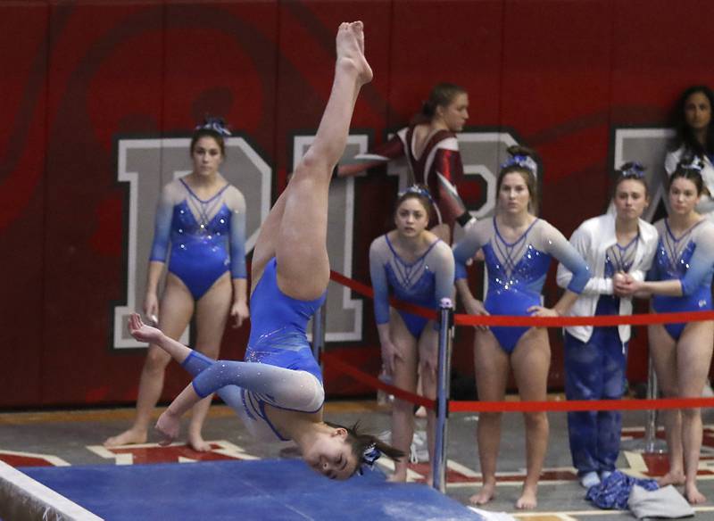 Vernon Hills' Livy Tran competes in the preliminary round of the balance beam Friday, Feb. 17, 2023, during the IHSA Girls State Final Gymnastics Meet at Palatine High School.