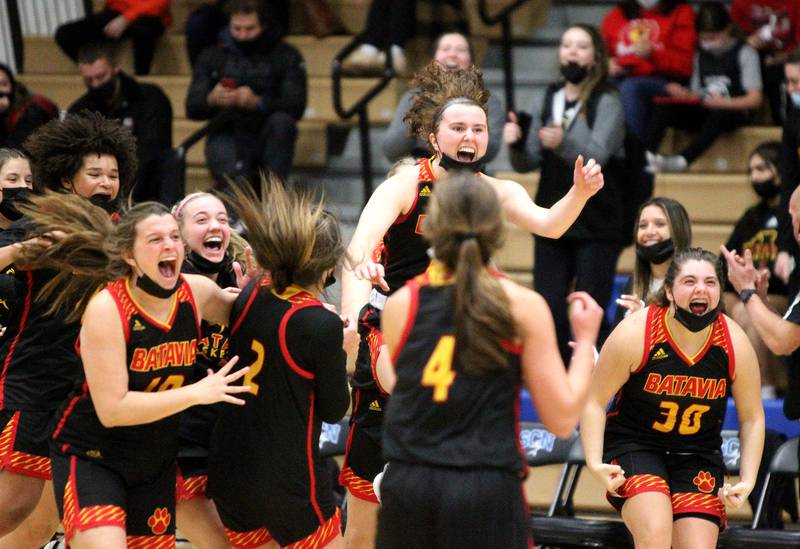 Batavia players celebrate their overtime win over St. Charles North at North on Thursday, Jan. 13, 2022.