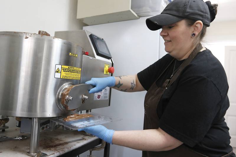 Briana McKeen poured chocolate into a mold on Thursday, March 27, 2025, at Anderson's Candy Shop in Richmond.