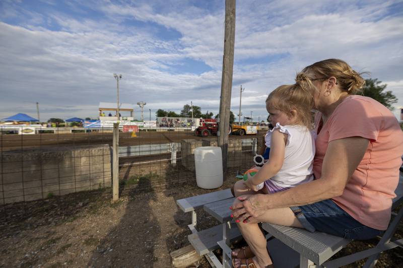 Emersyn Sargis, 2, sits with grandma Lisa Erickson Thursday, July 24, 2025, to watch the Lee County Fair truck and tractor pulls. The fair officially kicked off Thursday.