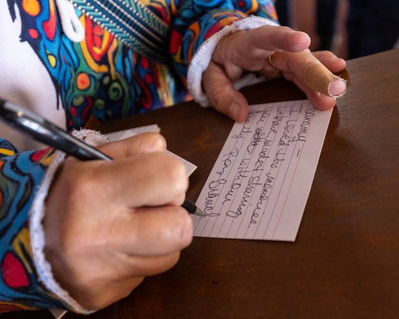 Ruth Herbst writes note for Sam Leone at Sam’s retirement celebration on Saturday, October 25, 2025 at the Rootbeer Stand in Oglesby.