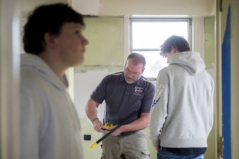 Whiteside Area Career Center building trades teacher Matthew Hicks works with students on several projects around the area, including the renovation of the kitchen and break room at the Regional Office of Education building in Sterling.