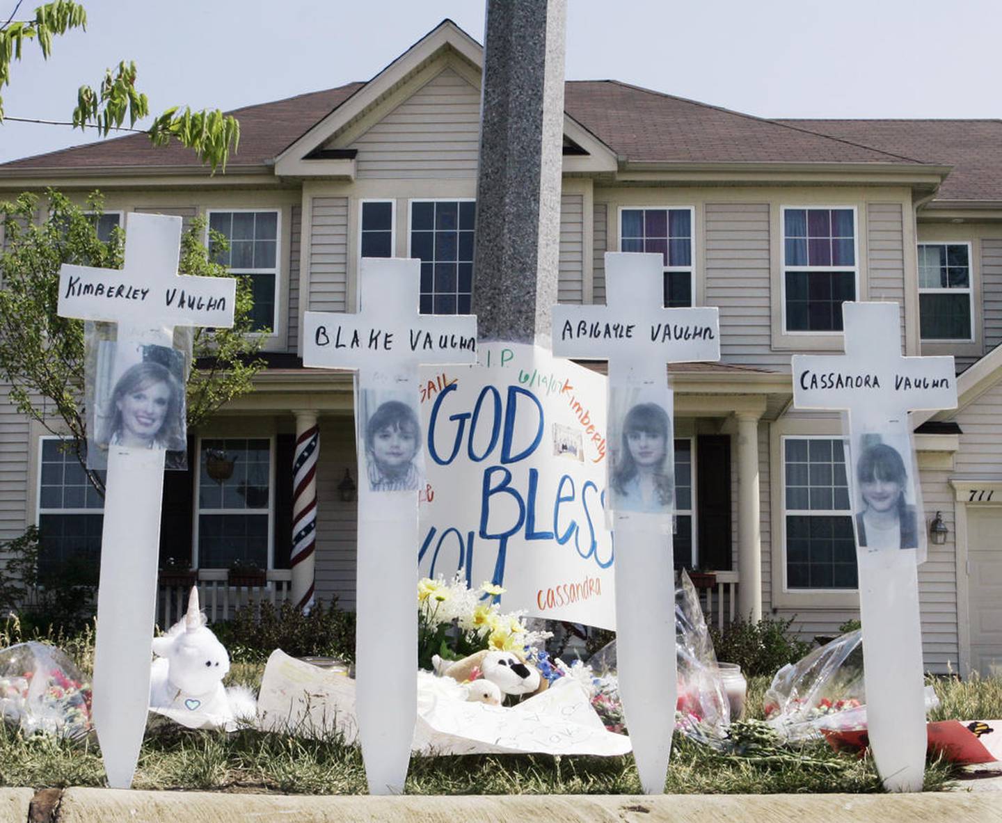 A makeshift memorial to Kimberly Vaughn and her children Abigayle, 12, Cassandra, 11, and Blake, 8, is seen in June 2007 outside their home in Oswego. Christopher Vaughn was found guilty Thursday of murdering his wife and three children.