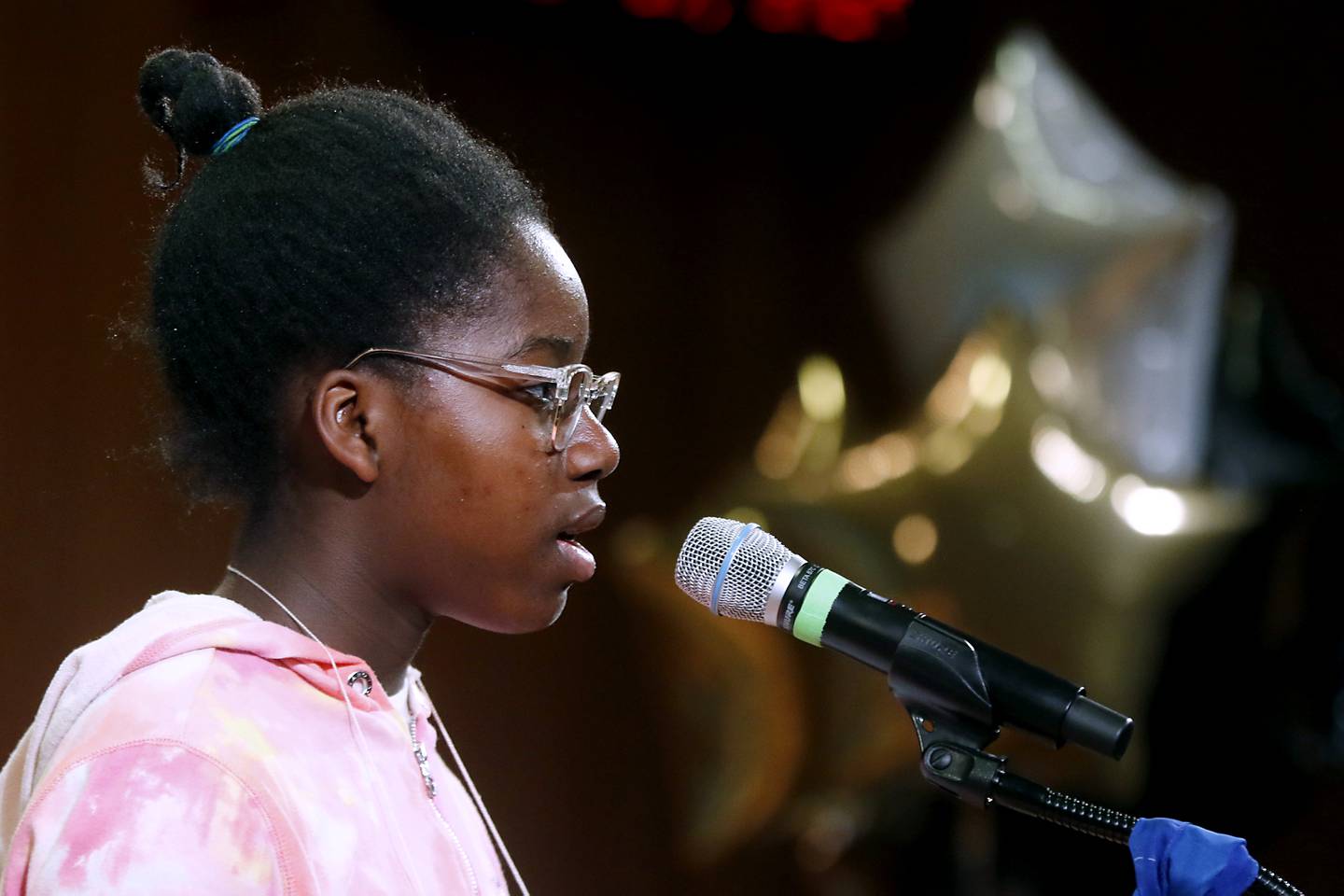 Olivia Naydenoff, of Marlowe Middle School, spells a word as she competes in the McHenry County Regional Office of Education 2024 Spelling Bee Wednesday, March 20, 2024, at McHenry County College's Luecht Auditorium in Crystal Lake.