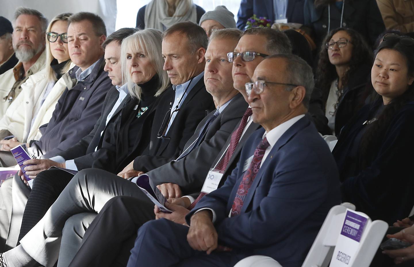 People listen to speakers Wednesday, Oct. 19, 2022, during a groundbreaking ceremony for McHenry County College’s Foglia Center for Advanced Technology and Innovation at the Crystal Lake campus.  During the ceremony, speakers spoke about the future of learning in the new center along with education's role in economic development.