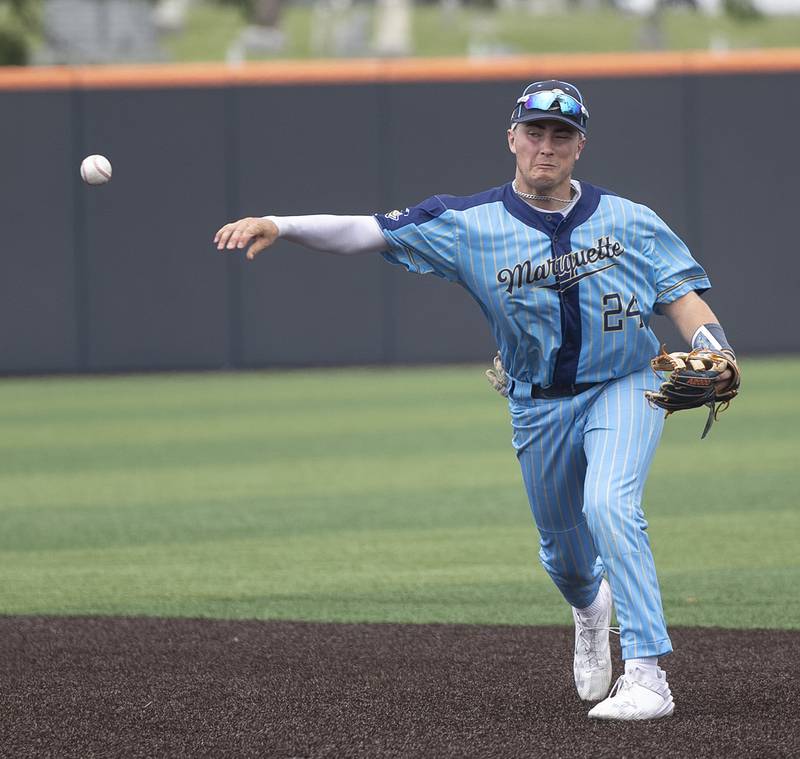Ottawa Marquette’s Anthony Couch throws to first for an out against Father McGivney Saturday, June 7, 2025, during the Class 1A state baseball final at Illinois Field in Champaign.