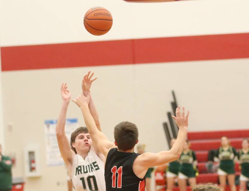 St. Bede's Phillip Gray shoots a jump shot over Stillman Valley's Michael Orlando during the 49th annual Colmone Class on Thursday, Dec. 7, 2023 at Hall High School.