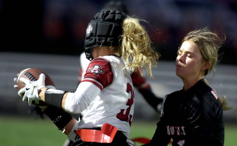 Huntley’s Addison Avi, right, grabs the flag of Antioch’s Reese Queensland in IHSA Regional varsity flag football action at Crystal Lake Central High School in Crystal Lake on Wednesday, Oct. 8, 2025.