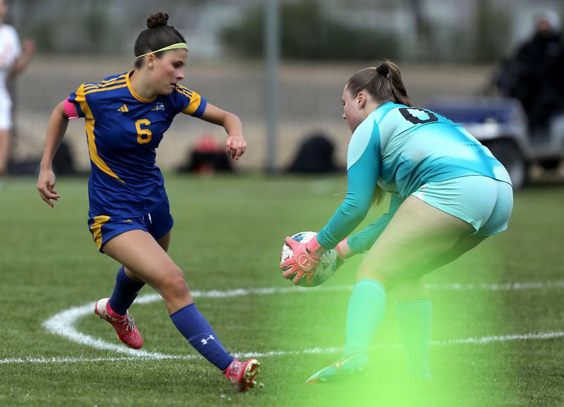 Richmond-Burton's Rylee Molczan (right) grabs the ball before Johnsburg's Liz Smith has a chance to kick the ball during the Kishwaukee River Conference Girls Soccer Tournament Championship match on Wednesday, May 6, 2026, at Johnsburg High School.