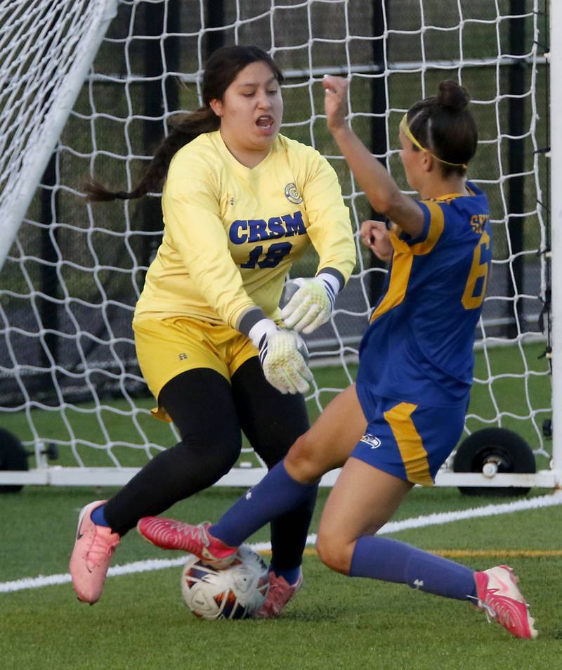 Cristo Rey St. Martin's Reyna Jimenez tries to stop as shot at the goal by Johnsburg's Liz Smith during an IHSA Class 1A Cristo Rey St. Martin Sectional semifinal girls soccer match on Tuesday, May 26, 2026 at Cristo Rey St. Martin College Prep, in Waukegan.