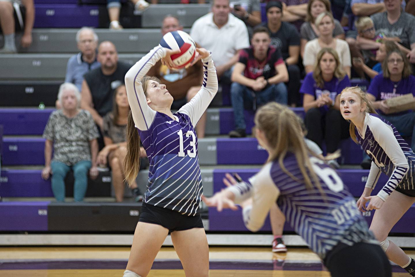 Dixon’s Hanna Lengquist sets the ball against Rockford Lutheran Tuesday, Sept. 20, 2022.