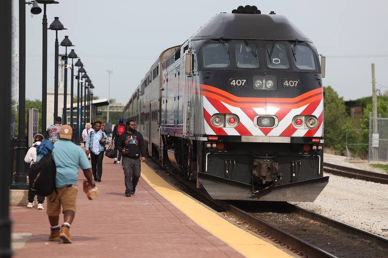 Commuter exit the 405 from Chicago at the Joliet Gateway Center station on Monday, May 15, 2023 in Joliet.