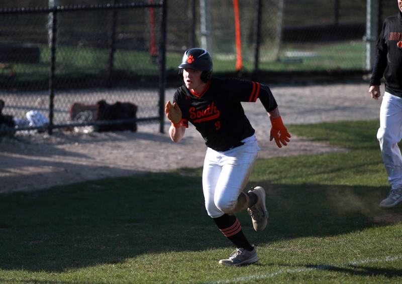 Wheaton Warrenville South's Ryne Adler runs home during a game against Geneva on Monday April 14, 2025 in Wheaton.