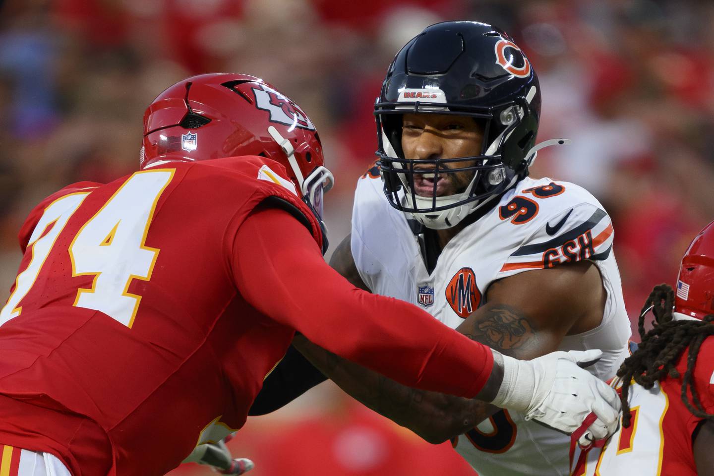 Chicago Bears defensive end Montez Sweat (98) battles Kansas City Chiefs offensive tackle Jawaan Taylor (74) during the first half of an NFL preseason football game, Friday, Aug. 22, 2025 in Kansas City, Mo. The Bears defeated the Chiefs, 29-27. (AP Photo/Reed Hoffmann)