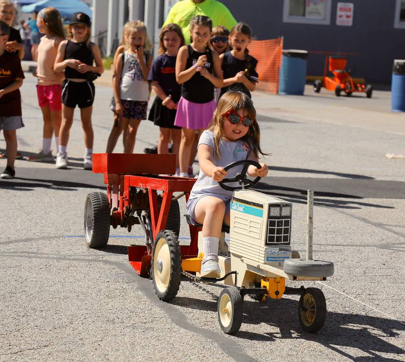 Four year old Lorelei Feith participates in the Kids Pedal Tractor Pull at the Maple Park Fun Fest on Saturday, Aug. 31, 2024 in Maple Park.