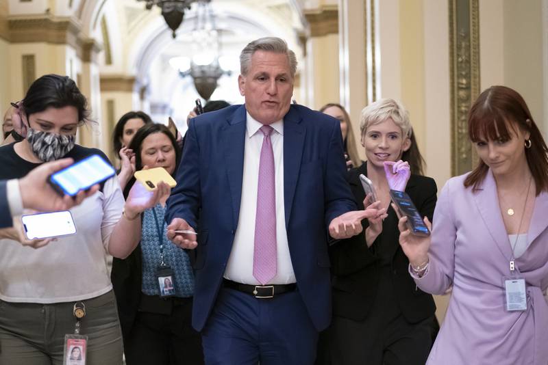 House Minority Leader Kevin McCarthy, R-Calif., heads to his office surrounded by reporters after House investigators issued a subpoena to McCarthy and four other GOP lawmakers as part of their probe into the violent Jan. 6 insurrection, at the Capitol in Washington, Thursday, May 12, 2022. The House Select Committee on the January 6 Attack has been investigating McCarthy's conversations with then-President Donald Trump the day of the attack and meetings that the four other lawmakers had with the White House as Trump and his aides conspired how to overturn his defeat. (AP Photo/J. Scott Applewhite)