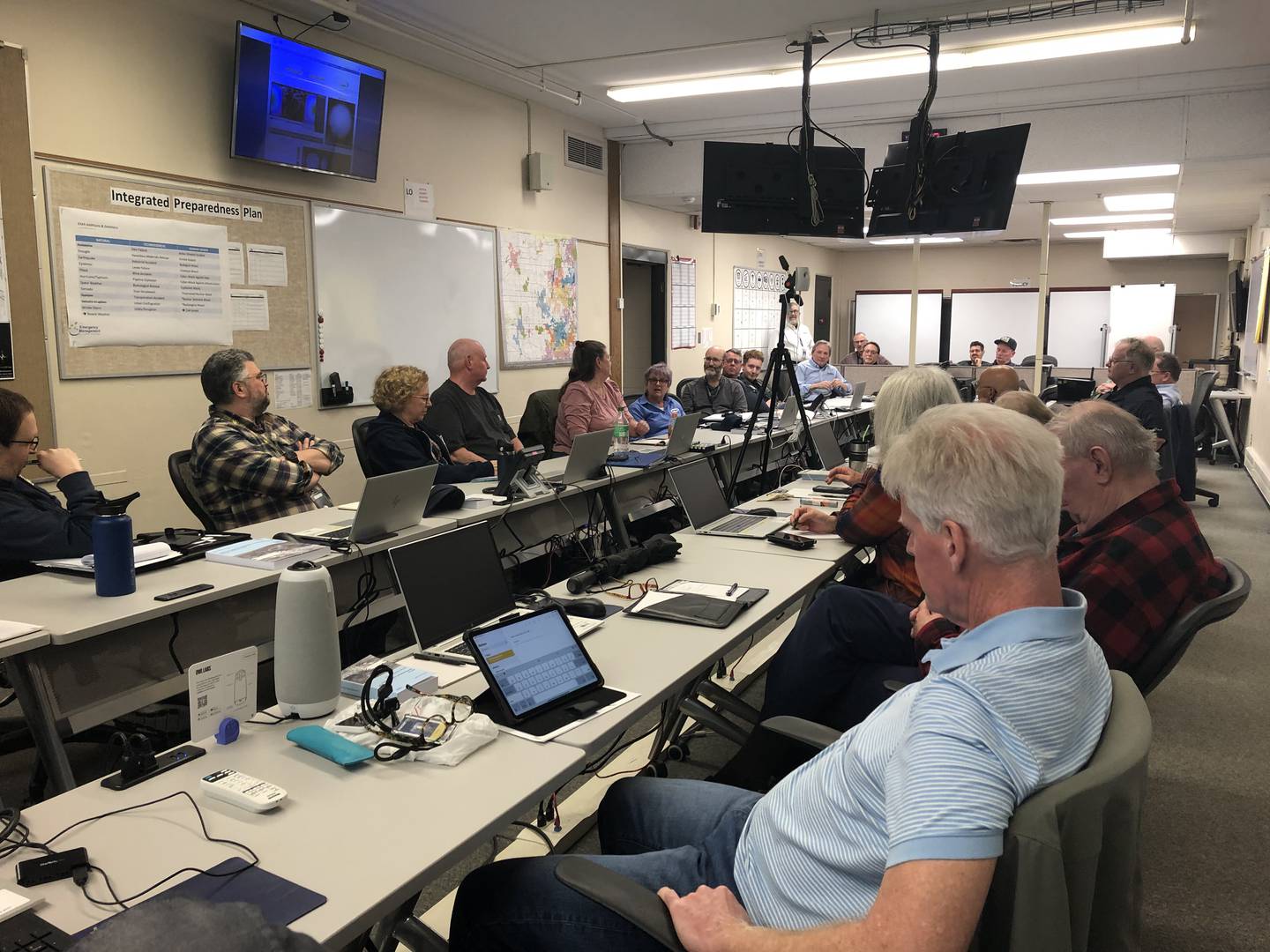 Volunteers listen at the McHenry County Emergency Management Agency March 13, 2024.