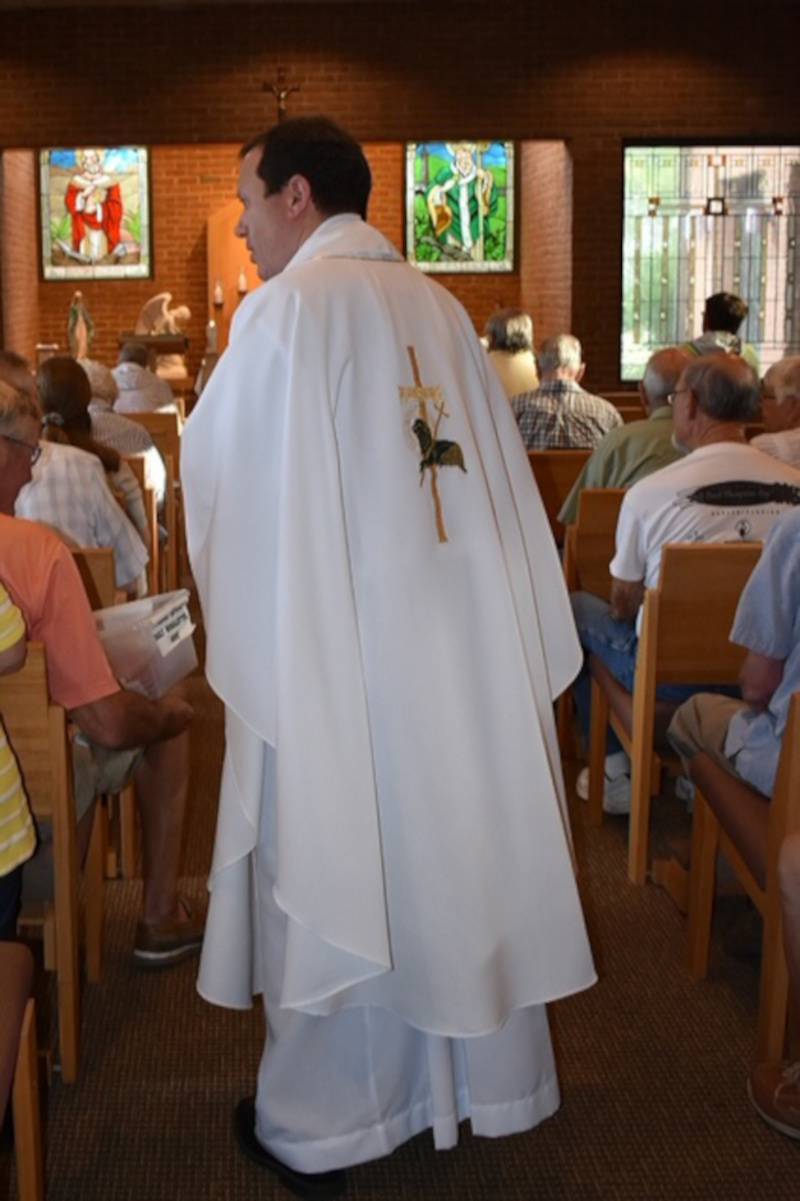 St. Patrick Parish's Fr. Matt wears the chasuble in memory of his friend Greg Milanowycz.