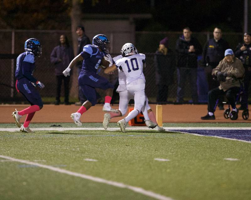 Downers Grove South's Kayden Smith pushes Addison trails defense for a touchdown on Friday, Oct.20,2023 in Downers Grove.
