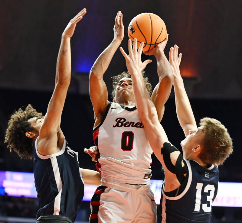 Benet Academy's Blake Fagbemi makes a strong move to the basket between Evanston's Jayden Rodriguez, left, and George Richardson during the IHSA Class 4A boys basketball state semifinals at State Farm Center on Friday, March 14, 2025 in Champaign.