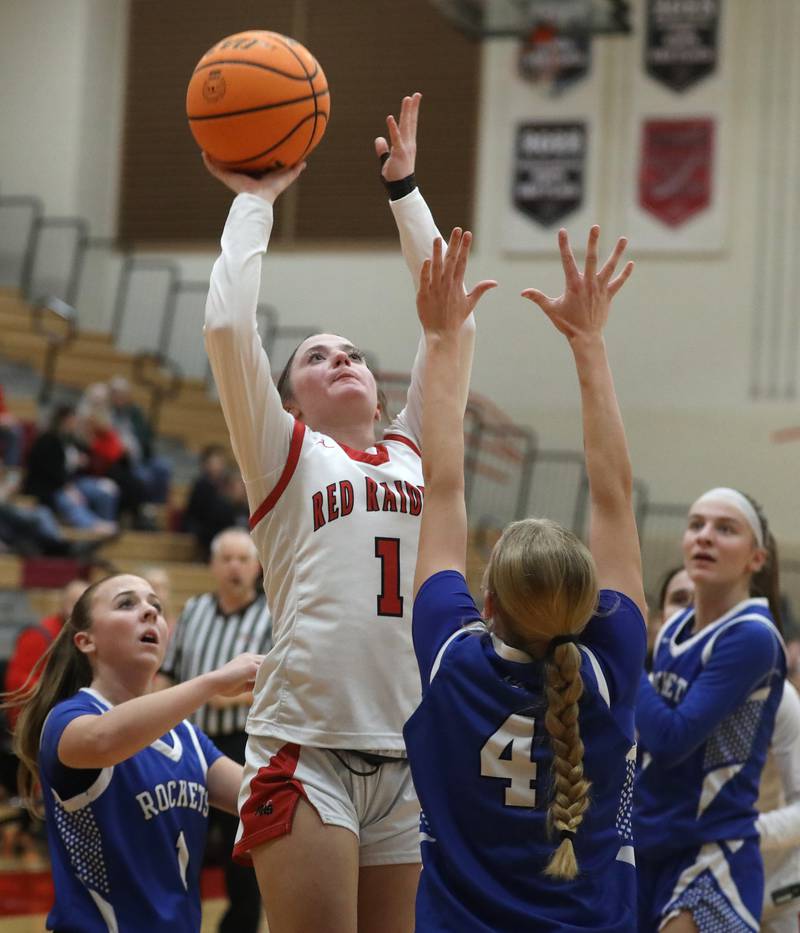 Huntley's Lana Hobday shoots the ball over Burlington Central's Ashley Waslo during a Fox Valley Conference girls basketball game on Tuesday Jan. 13, 2026, at Huntley High School.