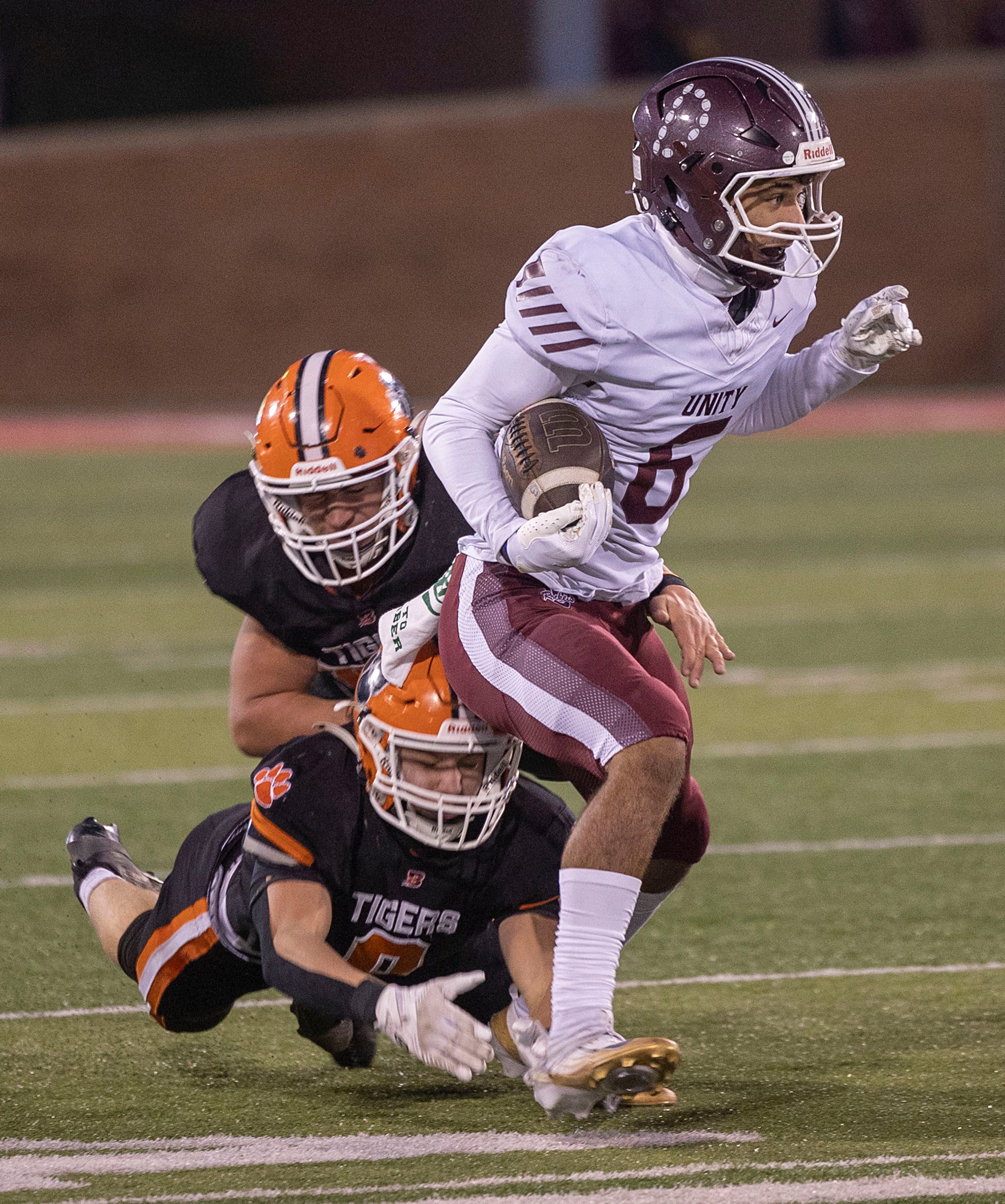Tolono-Unity's Tre Hoggard picks up yards against Byron Friday, Nov. 28, 2025, in the Class 3A football finals at Hancock Stadium at ISU.