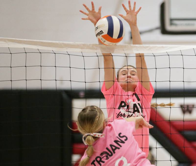 Woodland's Cloee Johnston (7) blocks a spike from Dwight's Erin Anderson (3) on Thursday, Oct. 6, 2022 at Woodland.