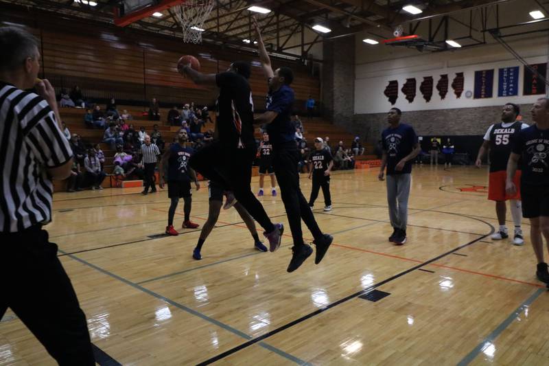 Darnell Coleman attacks the hoop for a layup Monday, Dec. 2, 2024, at the annual charity basketball game held at Huntley Middle School in DeKalb.