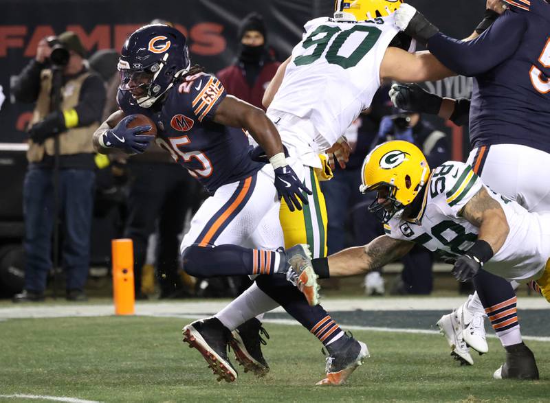 Chicago Bears running back Kyle Monangai pulls away from Green Bay Packers linebacker Isaiah McDuffie Saturday, December 20, 2025, during their game at Soldier Field in Chicago.